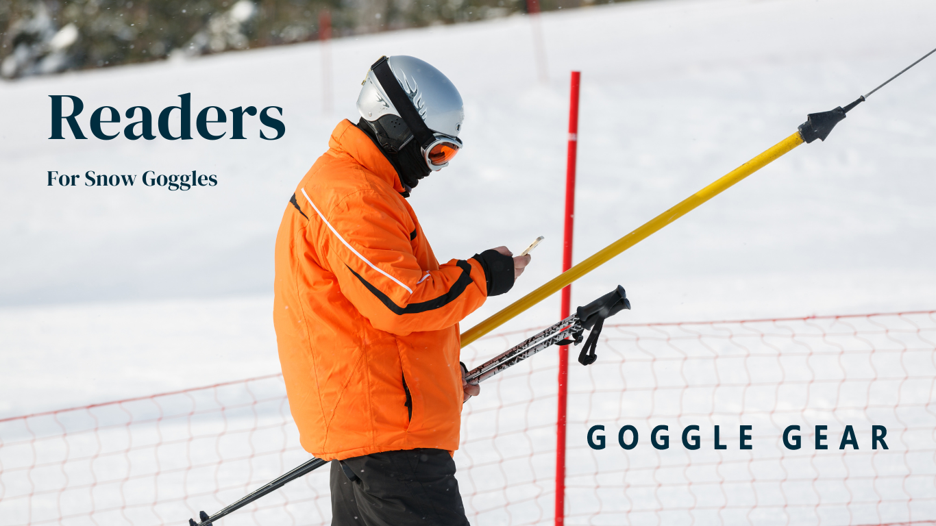 A skier wearing goggles looking down at his phone. Readers for Snow Goggle brought to you by Goggle Gear.